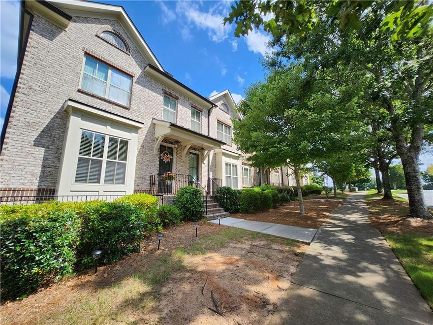 Rare opportunity! Brick-front townhome built in 2017 with 3 bedrooms, 3.5 bathrooms, and a 2-car garage—ideally located just minutes from vibrant Suwanee Town Center. Enjoy easy access to award-winning schools, shopping, dining, grocery stores, and the scenic Suwanee Creek Greenway with its walking and biking trails.

This bright and open floor plan features a spacious granite kitchen island, hardwood floors throughout the main level and master bedroom, and plenty of natural light. The terrace-level bedroom includes a full bath—perfect for guests. The master suite boasts a separate tub and shower, while the secondary bedroom includes its own private bath and large closet.
