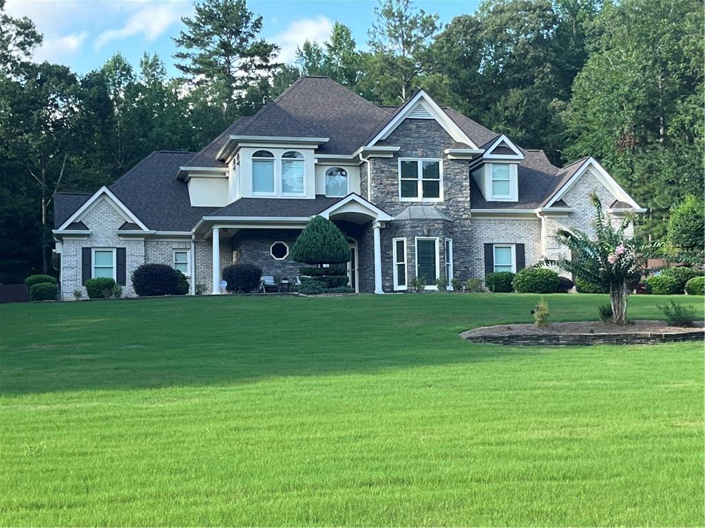 Located in Oxford's upscale community Longview Creekside. This home features over 4400 HEATED square feet on a 1.76 ACRE estate-size lot on a quiet cul-de-sac street with 4 bedrooms, 4.5 baths, office/5th bedroom, 4-sides BRICK exterior, 3-CAR garage with car charging station, 2-story family room with coffered ceiling/ FLOOR-to-CEILING stone fireplace with blower/ entertainment center & bookshelves, open kitchen to family room with breakfast area/ tile floor/ tile backsplash/ quartz surface countertops, new refrigerator, dishwasher, cooktop & microwave (all 2025), Gas range with electric dual ovens, upstairs media room with skylight & electric shade with remote, 2 owner's suites (one downstairs & one upstairs), all-season sunroom with floor-to-ceiling screened windows, separate dining room, large laundry room with wall cabinets/ wash sink & separate exterior entrance, Saltwater Pool (2022) with beach entry & stone border with new pool cleaner controller, Roof (2022), Carpet (2022) & Water Heater replaced in (2019), 4 new water efficient toilets . Additional highlights include guest bedroom downstairs with separate entrance to sunroom, California closets & PRIVATE BATH, 1/2 bath on main for guests, Anderson storm doors with sliding glass/hidden screen, crown molding throughout, flagstone front porch, CUSTOM built gazebo with light/fan/electric & TREX flooring, STAINED GLASS windows over both owner suite jetted tubs, alarm system/ring doorbell & ring flood lights with cameras, privacy fenced back yard, storage building, garden house walls with raised beds (no roof), outdoor fire pit, river rock backyard drainage, covered wood storage for firewood, 6-person HOT TUB with Bluetooth speakers, cabinets & tool storage in garage, blueberry & fig bushes, 2-story windows in family room and windows above the stairs feature custom electric shades with remotes, 3 separate thermostats plus Lennox mini-split in sunroom, professional landscaping and lawn sprinkler system front and back with smart phone controller, extended driveway & landscape lighting front & back. Conveniently located to Covington, Conyers Loganville & Monroe. Also nestled between Cherokee Run Golf Course & Honey Creek Golf & Country Club, Conyers. Ashton Hills Golf Club, Covington. Bear Creek and Providence Golf Clubs, Monroe. Cedar Lake Golf Club, Loganville & The Creek at Hard Labor, Rutledge. Schedule your private showing through Showing Time. Thanks and all the best! NO SIGN IN YARD. HOA is Voluntary. See Preferred Lender, floor plans, etc., info in documents sections.