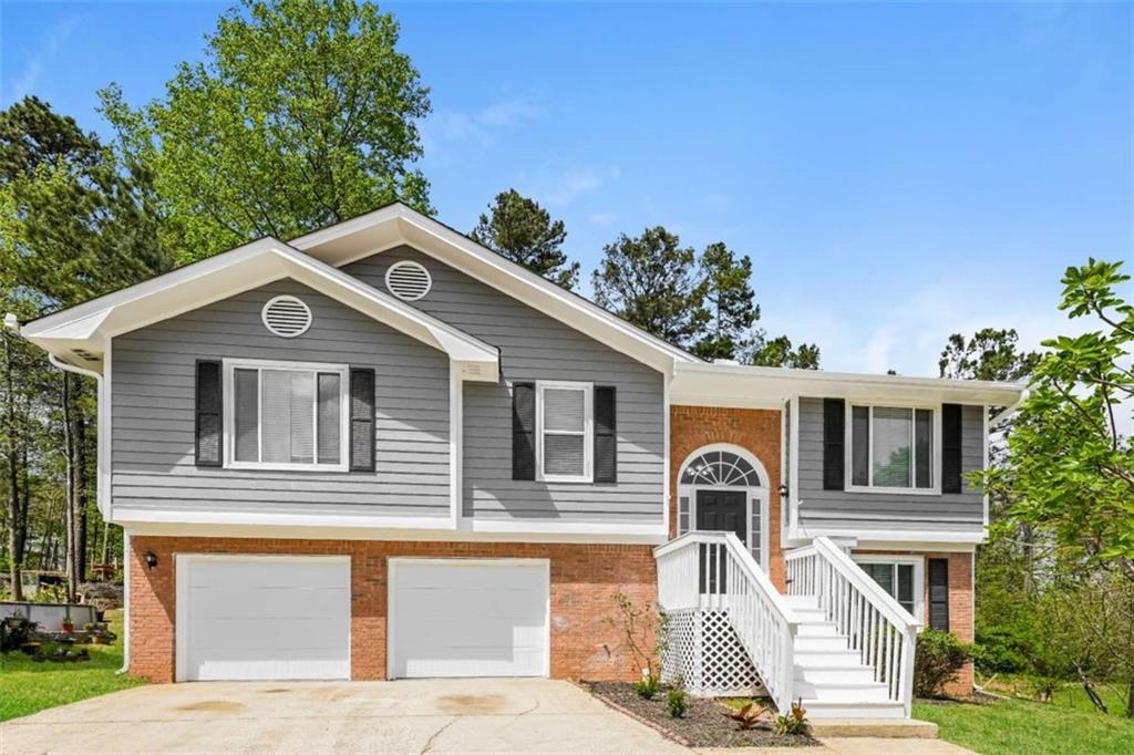 Spacious 4BR/3BA Home with Finished Basement & Prime Norcross Location This well-maintained split-foyer home offers a bright, open layout with 4 bedrooms and 3 full baths. Features include a 2-story foyer, family room with gas fireplace and deck access, and a large separate dining room with high ceilings and abundant natural light. The kitchen showcases freshly painted cabinets and a mosaic tile backsplash. Upstairs, the primary suite boasts a tray ceiling, walk-in closet, and bath with a separate tub and shower. Two additional bedrooms share a full bath on the upper level, while the lower level includes a fourth bedroom, flex room, laundry, and ample storage space. A spacious 2-car garage and HUGE storage room add convenience. Enjoy a cul-de-sac lot with a large backyard, plus new interior and exterior paint, new carpet throughout, and a newer water heater. Conveniently located near dining and shopping in Downtown Norcross, Discovery Garden Park, and Betty Mauldin Park-all with no HOA!