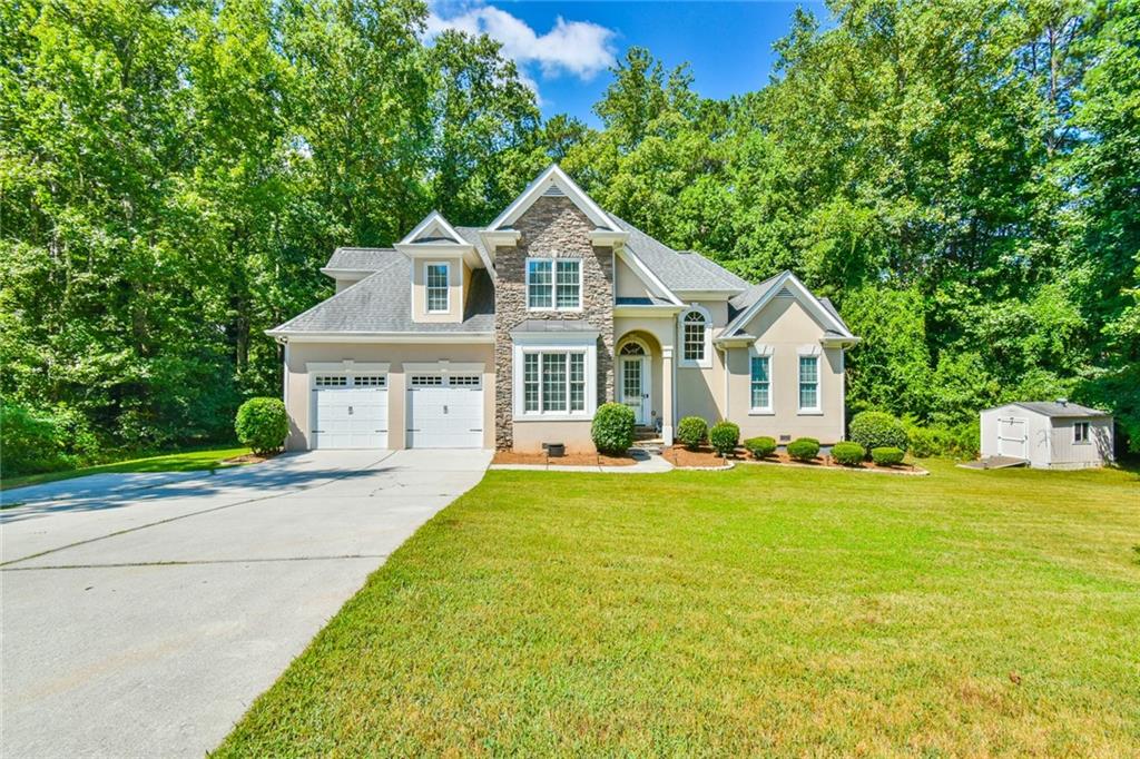 Welcome to this beautifully fully renovated and move-in ready home! This home has 4-bedrooms, 2.5-bathrooms and nestled on nearly an acre (0.93 acres) with no HOA – offering the perfect blend of modern luxury and suburban charm. From the moment you step inside, you'll appreciate the attention to detail and high-end finishes throughout the home.
The open-concept floor plan features a spacious main-level primary suite with a spa-inspired ensuite bathroom – a true retreat after a long day. The elegant wrought iron staircase adds character and sophistication, while the seamless layout creates a perfect environment for both everyday living and entertaining guests.
The home has been tastefully renovated with modern lighting, fresh interior paint, updated bathrooms and a new water heater-providing a truly move-in ready experience.
Enjoy the peace and privacy of your large, wooded backyard with a peaceful creek, ideal for outdoor entertaining, gardening, or simply relaxing in nature.
Located just minutes from the new Grove at Towne Center in downtown Snellville, this home puts you near an exciting new hub of restaurants, retail, community events, a public library, and a family-friendly splash pad. For even more recreation, Briscoe Park is within walking distance, offering sports fields, playgrounds, tennis courts, a pool, and scenic walking trails.
Don’t miss your chance to own this like-new home in a prime location – where modern upgrades, space, and lifestyle come together. Schedule your private showing today!