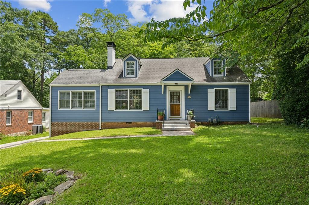 Located in Oakhurst in the city of Decatur, this is a most charming home in a fantastic neighborhood. Close to everything including incredible schools, lovely parks, restaurants and more, it's truly the perfect place to call home! Step through the front door and into a bright, open space that feels so welcoming and good. On the main floor, you’ll find a large den with plenty of natural light and a wood burning fireplace, an office / secondary den that is perfect for working, reading or napping...plus a full dining room and a wonderful kitchen with a large breakfast bar. The kitchen goes out to the quiet deck and expansive and amazing back yard. The primary suite is on the main floor and there is another large secondary bedroom and bathroom on the main floor. Upstairs, there’s even more to love—a bonus room and an extra bedroom both that can be anything you need, like a guest room, a playroom, or a creative space. The lot is massive and gorgeous and there is easy room for expansion if you need it. An excellent price for the location - this one is a MUST SEE!