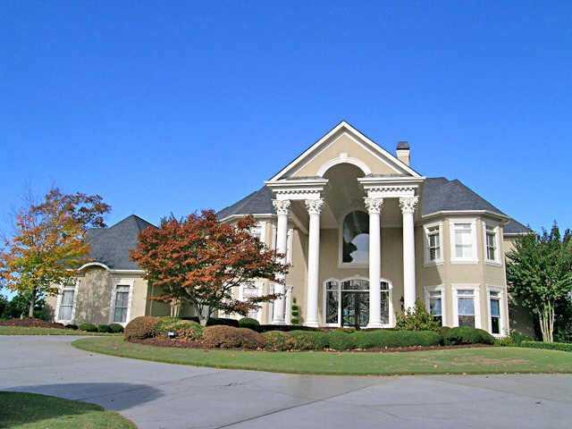 Absolutely magnificent HC Stucco estate on 1.3 acre private lot with porte-a-cache-Unique-Elegant-Exquisite home with many details-Unbelievable MBR suite-Finished terrace level with entertainment center-Wall of windows overlooking