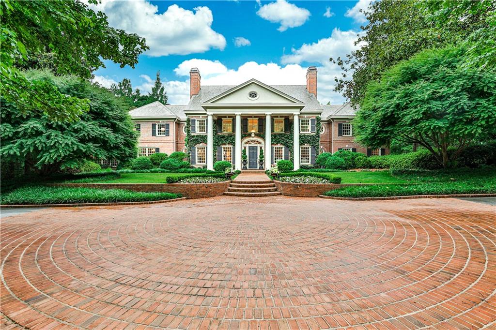 One of the most extraordinary properties in all of Buckhead, this private 5+/- acre gated estate offers a true escape in the heart of prestigious Tuxedo Park.  Custom built home includes the Main House with 7 Bedrooms, Guest House with 2 Bedrooms, plus additional Guest House with 1 Bedroom and boasts garage parking for 9 cars. This home is perfect for entertaining, both indoors and out. The Kitchen was recently renovated with beautiful white marble countertops and state of the art appliances.  Amenities include House Generator, Commercial Grade Water Filtration System and HVAC, Irrigation Well,  Lutron Lighting System, Automated Entry Gate, Audio and Security System and extensive outdoor Lighting. This is a must see for the discriminating buyer seeking privacy and solitude.