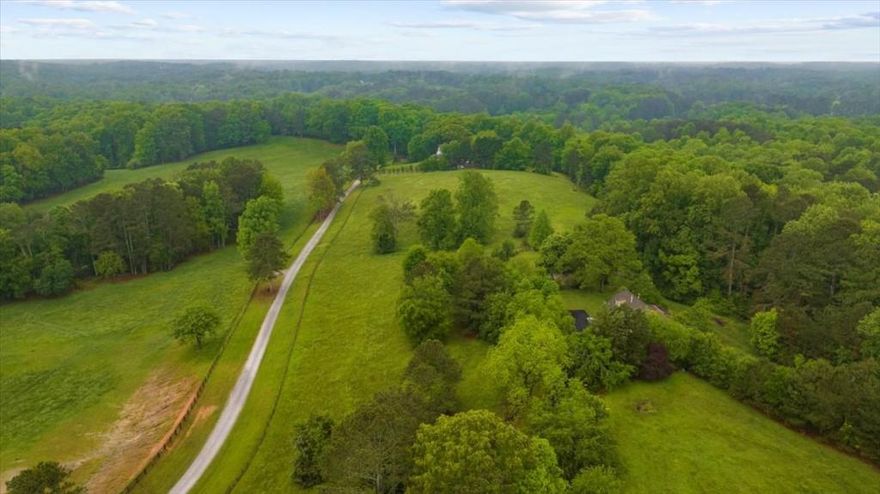 Rare 9.78-Acre Opportunity in Sought-After Southeast Cherokee County with Alpharetta Address. Discover the perfect canvas for your dream estate on this expansive 9.78-acre property, combining 791 and 855 Rivendell Lane. Nestled in one of Cherokee County's most desirable areas, this land offers an incredible opportunity for a private retreat or future development. The homesite sits atop a gently rolling hill, capturing stunning panoramic views of the surrounding countryside. With a blend of open pasture and mature hardwoods, the setting is both peaceful and versatile. Whether you envision one sprawling estate or the potential to divide into two separate lots, this property offers endless possibilities all just minutes from top-rated schools, shopping, and dining.