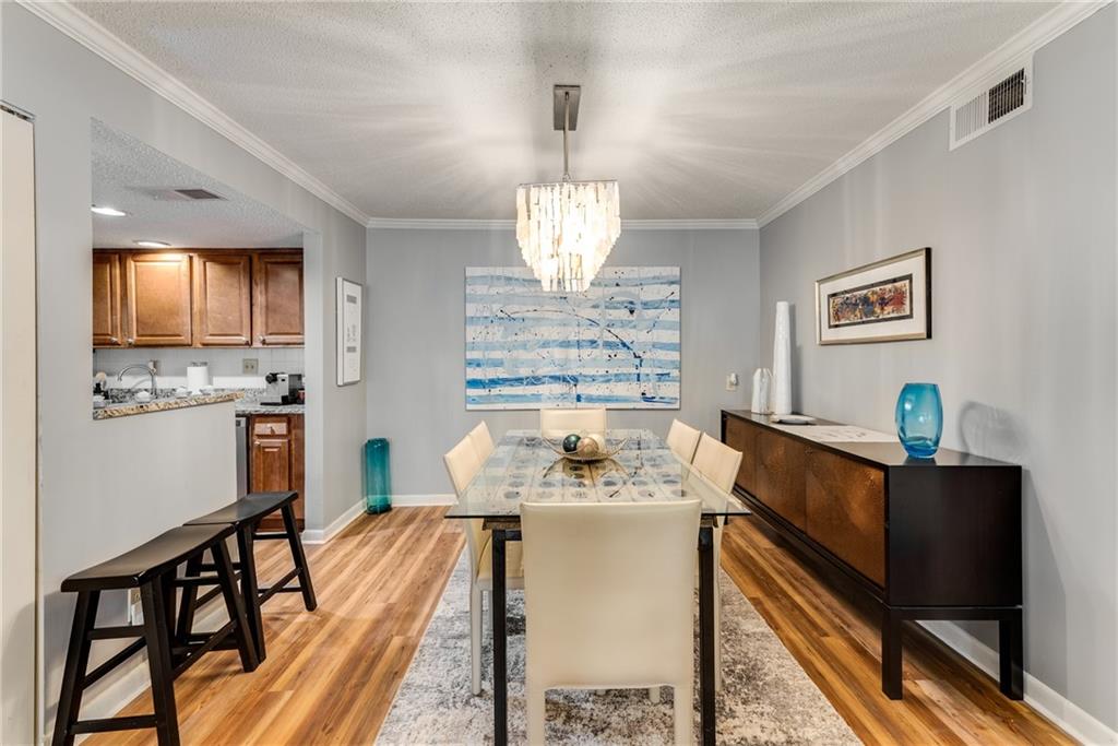 LOW HOA fees at this stunning 2 bedroom, 2 bathroom condo in the gated Highgate community in Sandy Springs. This condo has been beautifully updated with new flooring, fresh paint, and a new HVAC system (interior and exterior). The stepless unit is located in a gated community, providing both security and convenience. The area offers easy access to GA-400 and I-285, and is close to several prestigious schools, including The Art Institute of Atlanta, Argosy University, and Georgia Perimeter College. Additionally, MARTA is nearby for effortless commuting. The condo includes one assigned parking spot with plenty of guest parking available, and residents can enjoy the community pool, fitness center, clubhouse, dog park, and manicured landscaping with Low HOA fees.