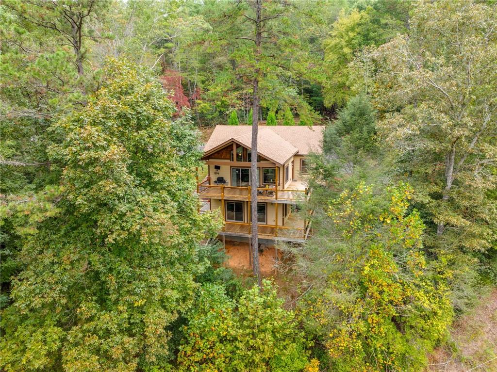 Turnkey Mountain Retreat — River Views & Luxury Finishes Without the Blue Ridge Premium. Welcome to your serene escape in the heart of the Blue Ridge Mountains, where breathtaking river views and the sounds of the Toccoa River create the perfect backdrop for a life well-lived. This 3,152 sq. ft. home, built in 2018, offers luxury without the Blue Ridge premium — a meticulously crafted 3-bedroom, 3-bath retreat designed for those seeking both comfort and tranquility. ? Property Highlights: Riverside Views Without the Upkeep: Enjoy the beauty of the river without the maintenance or flood risk. Relax on the porch with your morning coffee while taking in panoramic views and the soothing sound of rushing water. 25-Minute Retreat to Blue Ridge or Blairsville: Experience the perfect blend of seclusion and accessibility. Just far enough to feel like a true escape but close enough to enjoy the vibrant dining and shopping scenes in both Blue Ridge and Blairsville. Gourmet Eat-In Kitchen: A modern, chef-inspired kitchen designed for entertaining. Thoughtful layout, premium appliances, and ample counter space make hosting a breeze. Craftsmanship & Comfort: Built with quality and attention to detail, this home features spacious bedrooms, a seamless flow between indoor and outdoor living, and a whole-house generator for peace of mind. Relax & Recharge: Unwind after a long day in your private, wooded sanctuary. Whether it’s morning coffee on the porch or evening gatherings with the river as your soundtrack, this home offers endless opportunities to reconnect with nature. ? Ready to Experience True Mountain Living? If you’re searching for a place where nature, privacy, and quality craftsmanship converge, this is it. Schedule your private viewing today and discover the lifestyle waiting for you in Blue Ridge or Blairsville.