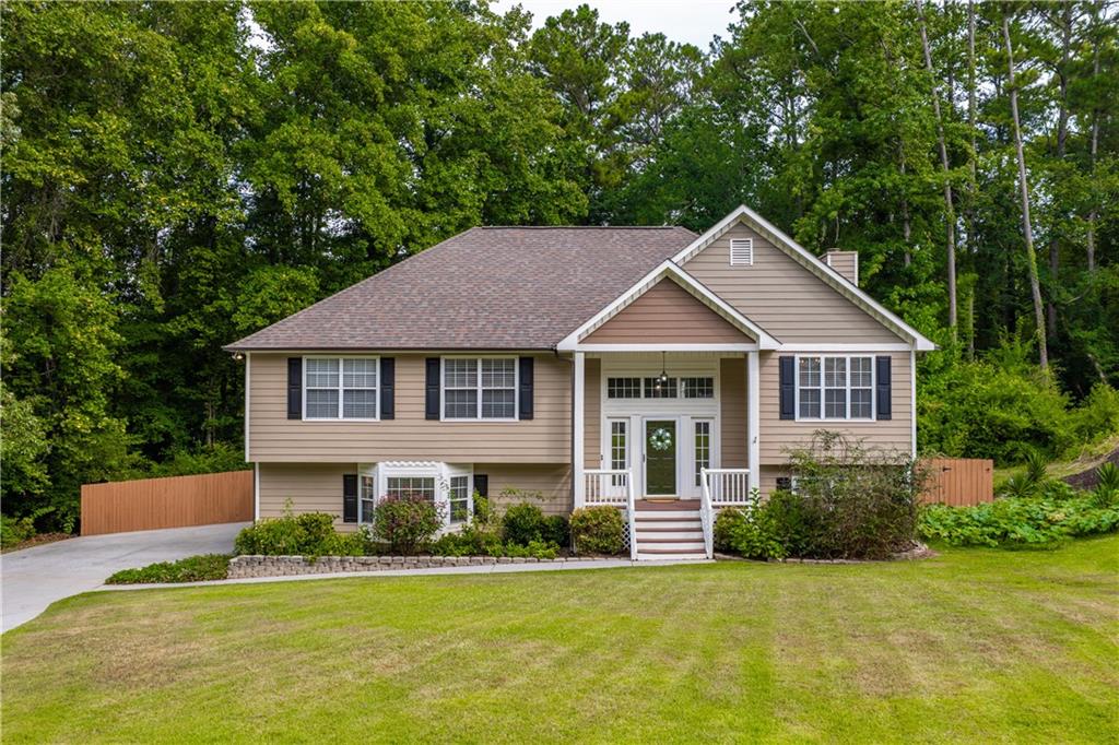 Welcome to this beautifully updated and meticulously maintained home in the highly sought-after Harrison High School District. With over $85,000 in thoughtful renovations and improvements since 2020, this home is truly move-in ready! The owner has taken care of every detail! Enjoy new LVP flooring throughout, freshly painted walls, ceilings, and trim, refinished oak stairs, updated LED lighting and stylish Ballard Designs chandeliers. The reimagined open-concept layout between the living room and kitchen enhances the flow and feel of the main living areas. The kitchen and bathrooms have been tastefully upgraded with new vanities, granite and recycled glass countertops, updated fixtures, new stainless appliances, mirrors, lighting, and elegant tile work. The primary suite features an Elfa closet system and a fully updated en suite with dual sinks, new toilet, and beautiful recycled glass vanity. Additionally closets have been upgraded with IKEA closet systems. The finished lower level offers a versatile and spacious layout, featuring a cozy family room with a whitewashed brick fireplace, dedicated office space, a guest bedroom, full bathroom and laundry closet. The sliding glass doors lead to the fully fenced back yard making this level perfect for multigenerational living, remote work, or entertaining. Enjoy outdoor living with freshly stained decks, a rebuilt fireplace exterior, privacy fencing, French drains, and a pet-friendly setup with dog and cat doors. The landscaped yard is a gardener’s dream with strawberries, pumpkins, wild blackberries, hydrangeas, knockout and climbing roses, butterfly bush, azaleas, camellia, lavender crepe myrtle, and more. With all major systems serviced and so many thoughtful upgrades, this home offers peace of mind, convenience, and beauty - all in a fantastic location near top schools, shopping, and parks. Don’t miss your chance to own this turnkey gem!