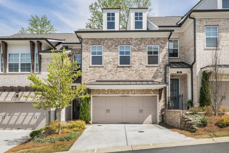 Welcome home to this rare, beautiful 2-story townhome in the sought-after Atley community, directly connected to the Alpha Loop greenway. The open-concept main level features a private foyer, a spacious fireside family room, and a designer kitchen with gorgeous white cabinetry and quartz countertops. A large glass sliding door leads to a raised, covered deck with stunning wooded views over the greenway, perfect for relaxation. The large owner's suite features a spa-like ensuite bathroom with a vaulted ceiling, an oversized shower with three plumbing fixtures including a rain head, and tile surround to the ceiling. All bedrooms boast large walk-in closets. The home also includes a 2-car garage with a driveway long enough for two additional cars.  Located within the gated Atley community, residents have access to a pool, cabana, dog park, and neighborhood garden, all set amidst beautifully landscaped lawns. The community is ideally located within easy reach of Maxwell Retail, Avalon, and Downtown Alpharetta, with easy access to the Alpha Loop for a convenient connection to top local attractions. With top-ranked Milton schools nearby and just a mile from GA400, this home combines a peaceful retreat with easy access to shopping, dining, and entertainment.