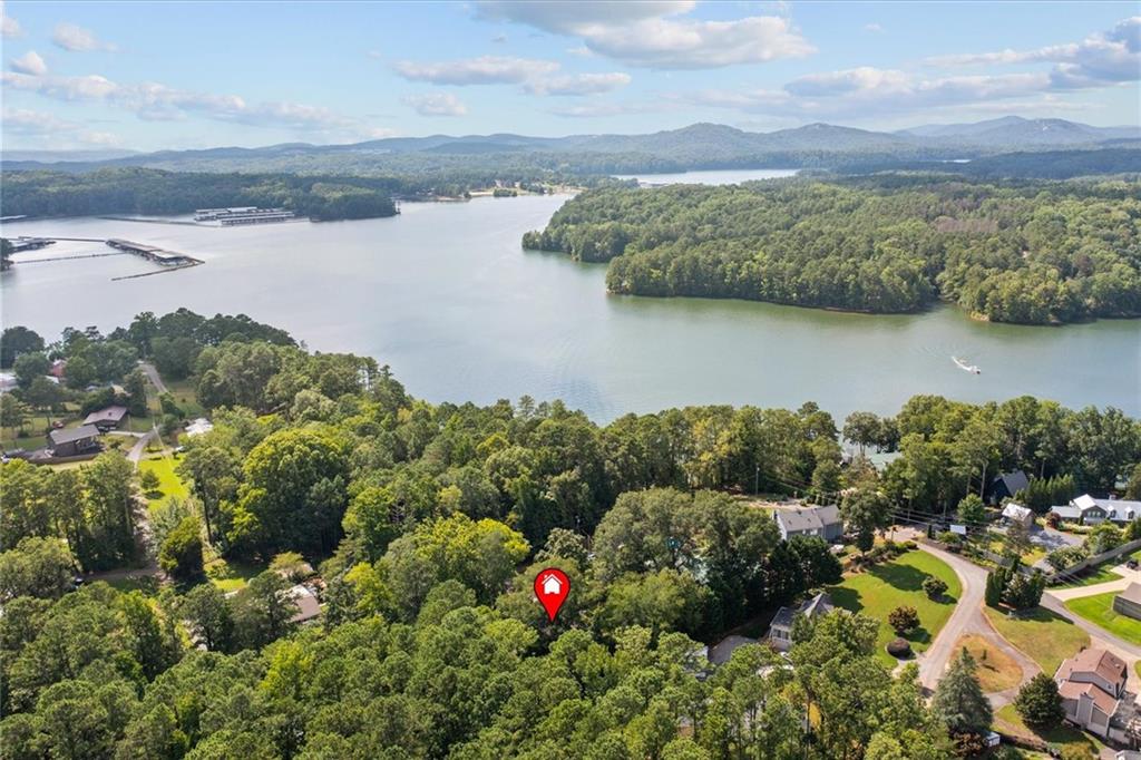 Welcome to your escape to Lake Allatoona. This 3-bedroom, 1-bath home offers over 2,200 square feet of space and includes a lifetime dock lease through the Corps of Engineers for just $25 per year—an exceptional value for lake access.
Just a short walk to your own private dock - bring your boat, kayak, or fishing gear and enjoy the lake life full-time or turn this into your next short-term rental investment. With no HOA, you have the freedom to make this property your own.
Inside, the home is full of charm, with vintage touches and large windows that bathe the living spaces in natural light. The screened-in porch provides a relaxing, all-season space to enjoy the outdoors without leaving the comfort of home. Step outside to a spacious deck nestled beneath mature trees; ideal for grilling, gathering with friends, or soaking in the peaceful sounds of nature.
A lake property that's only 5 minutes to I-75 and 45 minutes from Atlanta - the perfect getaway!
Don’t miss this opportunity to own a lake property with space, privacy, and unbeatable value. Schedule your private showing today and see how life at the lake could be yours.