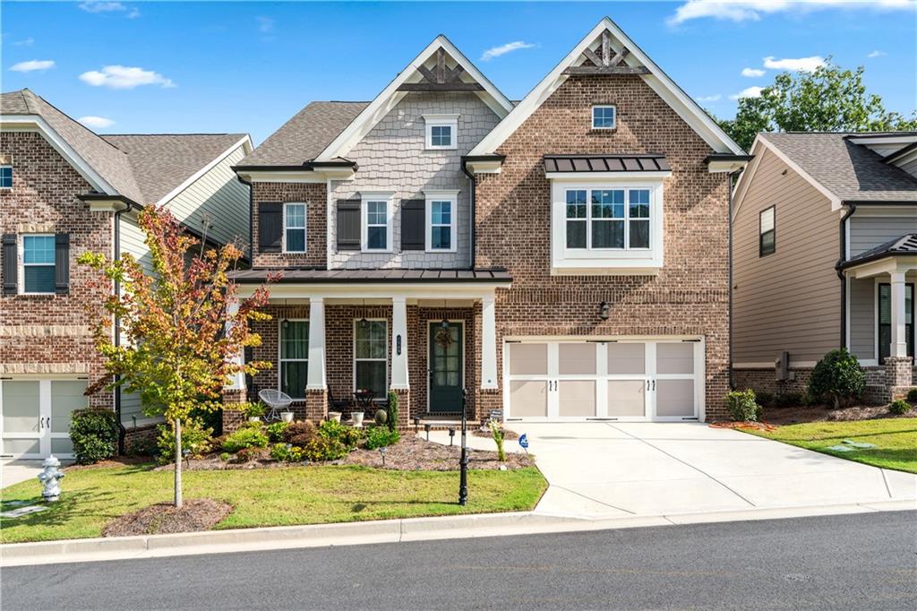 MUST SEE INSIDE, LUXURY LIVING IN GATED ELLINGTON! This home features a sunning open-concept design that everyone admires for its beauty and elegance and a beautiful hardwood floors throughout the entire house.
Start your morning with a cup of coffee while enjoying the picture-perfect view of lush trees right from your living room-it feels just like being in a stylish cafe.
Convenience meets comfort with a gest parking space right in front, and the rare luxury of a gated new-construction community in Suwanee area. Modern, spacious, and designed for both everyday living and entertaining, this home is truly a hidden gem.
All in a prime location direct access to Peachtree Ridge park and close to shopping.