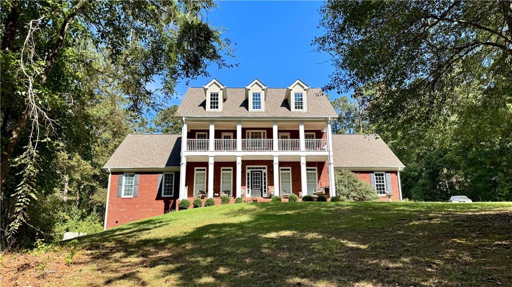 Discover your dream home in the highly sought-after Loganville High School cluster district! This stunning brick twostory home sits on a sprawling 2-acre lot and boasts a full basement and an inviting swimming pool. From the welcoming rocking chair front porch to the elegant interiors, this 4-bedroom, 3.5-bath residence is designed for both comfort and sophistication. Step inside to a grand two-story foyer with gleaming hardwood floors that flow into the formal dining room. The spacious great room features a cozy stacked stone fireplace, perfect for gatherings. The bright, open eat-in kitchen is a chef's delight, offering stained cabinets, a tiled backsplash, gorgeous countertops, and a convenient pantry. Retreat to the main-level master suite with a trey ceiling, two large closets, and a spa-like ensuite complete with double vanities, a garden tub, a separate tiled shower, and tile flooring. Upstairs, you'll find three additional bedrooms, two full baths, and a versatile office or bonus room. The full, unfinished basement provides endless possibilities for customization. Outside, enjoy the fenced backyard oasis, ideal for entertaining or relaxing by the pool. The large front and back yards offer ample space for outdoor activities. We VALUE & Welcome Buyer agents, please use Parkway Law Group as preferred closing attorney.