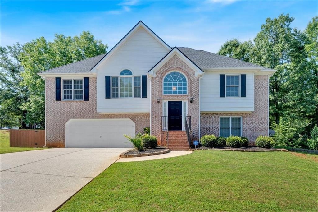 Brand new roof with a Golden Pledge Transferable Warranty and a brand-new deck!!! If you're looking for a move-in ready home with no maintenance headaches, this is the one. This beautifully maintained 4-bed, 3-bath home offers light-filled living, and space for everyone. The open family room features durable laminate floors and a cozy fireplace. Enjoy cooking in the kitchen with new stainless steel appliances and a sunny breakfast nook overlooking the fenced backyard. Relax or entertain on the large deck in total privacy. The main suite includes vaulted ceilings, double closets, and a spacious bath with soaking tub and walk-in shower. The finished lower level adds a bedroom, full bath, laundry, and flexible living space—perfect for guests, in-laws, or a playroom. Bonus room off the 2-car garage is ideal for storage, hobbies, or a workshop. Located in a quiet, established neighborhood—this move-in ready home is a must-see!