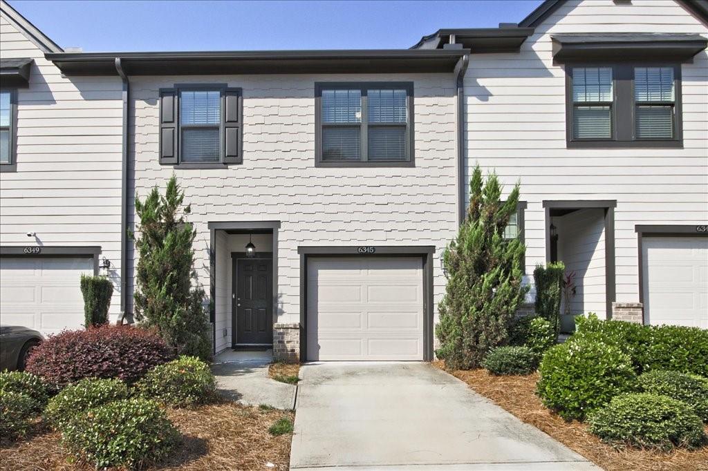 This stylish 3-bedroom, 2.5-bath home by Ashton Woods is just 15 minutes from downtown Atlanta, nestled within a quiet Mableton Community - Overlook at Queens Creek. Just 30 minutes from Truist Braves Stadium or the airport, there is easy access to I-20 and I-285, shopping, dining, and entertainment. This home's spacious, open layout welcomes you with a bright foyer that flows into a modern living area filled with natural light. The sleek kitchen is a dream for anyone who loves cooking or entertaining, featuring dark espresso cabinets, stylish granite countertops, an oversized island, and stainless steel appliances. Upstairs, the primary suite offers a peaceful retreat with a huge walk-in closet and a private ensuite bathroom. Outside, the back patio is perfect for relaxing after work or hosting a casual BBQ with family and friends. A perfect combination of modern living and convenience—schedule a tour today!