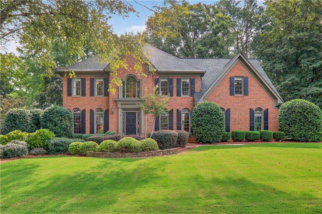 Tucked away on a quiet street in one of Roswell’s most welcoming neighborhoods, this 5-bedroom, 4.5-bath home is made for family living. With over 5,100 square feet of thoughtfully designed space, it’s where everyday comfort meets neighborhood charm. The heart of the home is the kitchen that extends into a casual dining area with the living room just beyond. Step right out onto the deck overlooking the private wooded backyard, the perfect spot for morning coffee, weekend grilling, or keeping an eye on the kids at play. Upstairs, the primary suite feels like a retreat with a recently updated spa like bathroom consisting of heated floors throughout. The secondary bedrooms are roomy and light-filled with newly refinished bathrooms. The finished terrace level is a true extension of the home, complete with its own bedroom, bath, and second kitchen, plus plenty of room for movie nights, game days, or sleepovers. Outside, the .8-acre lot is built for adventure and connection: a wide front yard, wooded area with a creek to explore, and a fire pit ready for marshmallow roasts under the stars. Life here extends beyond the property line, too. This vibrant HOA community offers a pool, clubhouse, playground, and year-round activities, creating an instant network of friends and neighbors. Add in the top-tier schools, and you’ve found the perfect place to put down roots.