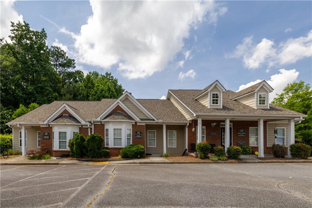 Great Location in East Alpharetta! This office with main and lower level offers several options to meet your business needs-use of total space with lower level as a great training/meeting area, or utilize one level and lease the other. Entrances, lobby area, office space, kitchen and baths on both levels. The monthly HOA includes water, sewer, exterior maintenance & trash.
