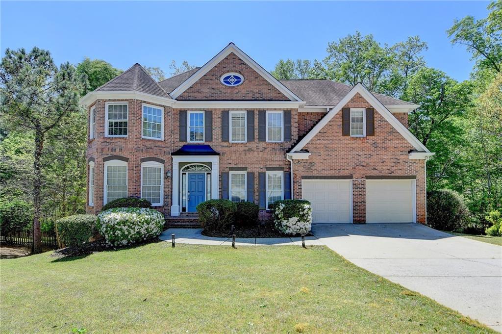This fully renovated home is located in the highly sought-after Sugar Mill community, ideally situated on a quiet cul-de-sac with a three-sided brick exterior and a private backyard. A full basement adds extra space and flexibility, while numerous large windows throughout the home let in an abundance of natural light. The entire house has been freshly painted inside and out, and boasts a new kitchen and completely updated bathrooms. A new HVAC system was installed in 2021 for added comfort and efficiency. Step inside to a dramatic two-story foyer and a two-story great room, both of which enhance the home's open and airy feel. Gleaming hardwood floors run throughout the main level and most of the upper floor. A versatile den offers space for a secondary living area, home office, playroom, or more. Upstairs, the spacious primary suite serves as a true retreat, featuring a tray ceiling, hardwood flooring, his and her closets, and a beautifully renovated bathroom. You’ll find three additional generously sized bedrooms and two full bathrooms. Set in an active swim/tennis community and served by top-rated schools, this home is also conveniently located near shopping, dining, and has easy access to Highway 141.