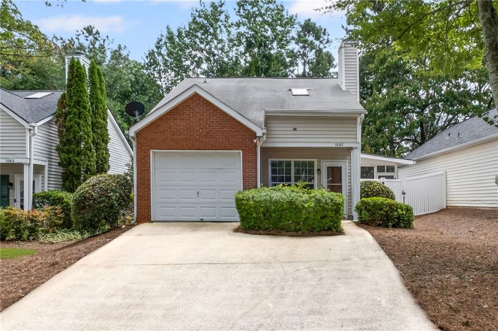 Welcome to this charming brick-front ranch home, perfectly situated in a quiet neighborhood with sidewalks and top-rated schools. Offering an open floor plan, a master and all living area on the main and stainless appliances, this home is designed for comfort and convenience. The spacious sunroom is ideal for enjoying your morning coffee or relaxing with a good book, while the large upstairs bonus room provides endless possibilities as a bedroom, media room, or office. A cozy fireplace anchors the main living space, and the vinyl-fenced private backyard is complete with paver walkways and an outbuilding for extra storage. The HOA maintains the front lawn, making this very low-maintenance home truly move-in ready. Enjoy a one-car garage, a bright and airy layout, and a prime location just off Bells Ferry Road and Eagle Drive—only minutes from the shopping, dining, and attractions of downtown Woodstock and the natural beauty of Lake Allatoona. This is the perfect blend of convenience, comfort, and easy living.