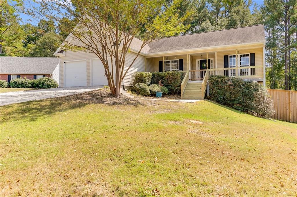 Welcome to this charming one-owner ranch home, ideally situated in a quiet cul-de-sac within a welcoming neighborhood, offering a
sense of privacy while still enjoying the benefits of a community setting. The home features a spacious covered front porch, perfect for
relaxing outdoors, and an extended rear deck designed for entertaining or unwinding in the fully fenced backyard. The basement is a
mechanic's dream, matching the square footage of the main living area and providing ample space for projects, with power and a
breaker box ready to accommodate a large air compressor. The main two-car garage, 19'6" deep by 12' wide, easily accommodates two
full-size short-bed quarter-ton trucks and includes convenient LED Chamberlain Bluetooth garage door openers. Inside, modern
conveniences include an updated Bluetooth thermostat, a gas tankless water heater for endless hot water, and a recently replaced
waterline from the street to the house. Fiber internet is available through Greystone Connect, with wiring already run from the exterior
to the living room. The home comes fully equipped with appliances, including a washer, dryer, refrigerator, and a convection air fryer
microwave. The kitchen has been thoughtfully updated with beautiful wood flooring installed less than three years ago, a subway tile
backsplash, a motion-activated faucet over a white cast iron sink, and a whisper-quiet garbage disposal. Bedrooms feature new carpeting
installed within the past three years, and the entire interior has been freshly painted for a move-in-ready appearance. Cozy up in the
living room next to the wood-burning fireplace, ideal for relaxing evenings. Outside, the manicured front lawn showcases seven recently
planted holly trees along the property edge, two mature crepe myrtles, and is further enhanced by a young Japanese maple and an
evergreen dogwood, adding charm and curb appeal. With its thoughtful interior updates, spacious living areas, functional garage and
basement, and a quiet cul-de-sac location, this home offers a rare opportunity to enjoy comfort, convenience, and a private, yet
connected, neighborhood lifestyle in one exceptional property.
