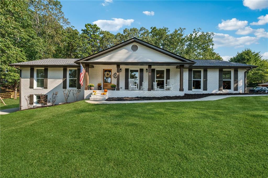 This highly sought-after, move-in-ready 2,334 sq. ft., 4-sided brick, 3-bedroom, 2.5-bath ranch home has been completely renovated with high-end finishes. The finished daylight basement includes a kitchenette, walk-in pantry, and half bath. Enjoy true privacy as this ranch home is nestled on a cleared 1-acre corner lot with NO HOA. The location is ideal—offering the convenience of downtown living while being just minutes from the lake and marina access.
Entertainers will love the open-concept design, featuring a high-end kitchen flowing seamlessly into the family and dining rooms—creating a true entertainer’s dream layout. Gatherings can extend onto the spacious deck and graded backyard, where a fire pit sets the perfect scene for evenings with family and friends.
The finished daylight basement provides separation from the main living and entertaining areas, making it ideal for a home office, media room, or family room. With a kitchenette, walk-in pantry, and half bath, the space is both functional and versatile. Additional storage is also available in the finished basement. Just outside, the concrete pad offers a perfect play space for kids or a flexible area to enjoy the rare cleared 1-acre lot.