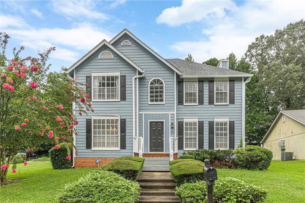 Charming 2-story home situated on a corner lot featuring a 2-story foyer, formal living room, and separate dining room. The eat-in kitchen offers stained cabinetry and ample space for casual dining. Upstairs, the oversized owner's suite includes a private en-suite bath with a double vanity, soaking tub, and separate shower. Spacious secondary bedrooms provide room for everyone. Enjoy outdoor living on the deck. Home is being sold as-is.