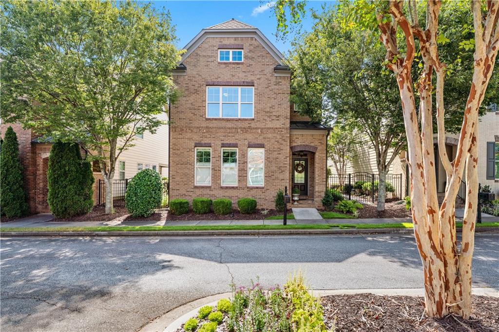 Wow! ABSOLUTE TURN KEY. Location, location, location! The original owner has meticulously maintained and updated this home with all of the highest quality materials. Walk to Halcyon, Trader Joes, Big Creek Greenway and so much more. Just minutes to the new McFarland exit at GA 400 being completed soon. Located in the sought after jamestown boasting an Alpharetta address with Forsyth County taxes. With four bedrooms and 3.5 baths this home will meet all of your needs. The two car garage is on the same level as the main living where there is no need for lugging groceries up stairs to the kitchen. The original owner of the home has spent over $75,000 making thoughtful and tasteful upgrades throughout which stands apart from many of the homes in Jamestown retaining builder grade finishes. Custom Roman shades in the living areas and kitchen upgrades includes new sophisticated, premium appliances, one-of-a-kind natural quartzite countertops from Brazil, granite composit sink, new hardware and backsplash, oversized color contrasting island and large walk-in-pantry. Wood accent walls add a beautiful dimension and warmth to the space. The primary bedroom offers two WICs and an updated bathroom with all natural quartzite counters, undermount sink, 8" spread faucets and a European shower enclosure with shiplap accent walls. Hardwood floors on the first level were upgraded to the primary bedroom and upstairs hallway. Two additon guest bedrooms share a Jack and Jill bathroom. The third floor boasts a private 4th bedroom configured as the Princess suite. (Currently used as an office it would also make a great media or gaming room). Custom 5" crown moldings and base moldings are in every formal or common space room of the home. The Charlestown style courtyard is fenced, private and boasts a blue granite walkway, flower covered trellis and lush easy to care for plantings. This courtyard is amazing and adds beautiful outdoor entertaining space for hours of enjoyment. The home was recently painted outside to give you a crisp new look for years of low maintenence. Jamestown is an active tennis, pickelball and swim community with low HOA fees. Looking at recent sales you will see what a rare opportunity this gem is. You won't be disappointed.