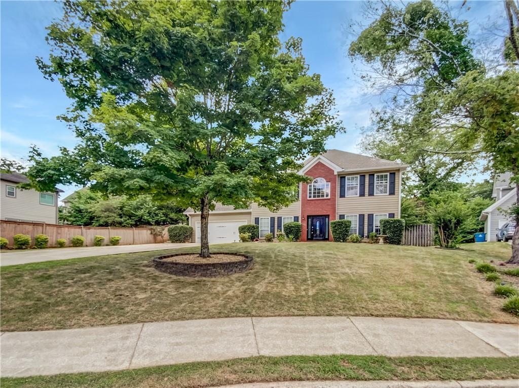Seller may consider buyer concessions if made in an offer. Welcome to this inviting property designed for comfort and modern living. As you step inside, you're greeted by a cozy fireplace that creates a warm atmosphere. The kitchen shines with stainless steel appliances and a stylish accent backsplash. The primary bathroom offers double sinks, a separate tub, and a shower, providing a luxurious retreat.The luxurious primary suite includes a large walk-in closet for ample storage. Outside, a covered patio is perfect for dining or enjoying morning coffee, while the fenced-in backyard offers privacy and space for outdoor activities. Fresh interior paint enhances the home's modern appeal and cleanliness. This property combines beauty and functionality, making it a true gem. Don't miss the chance to make this house your new home.