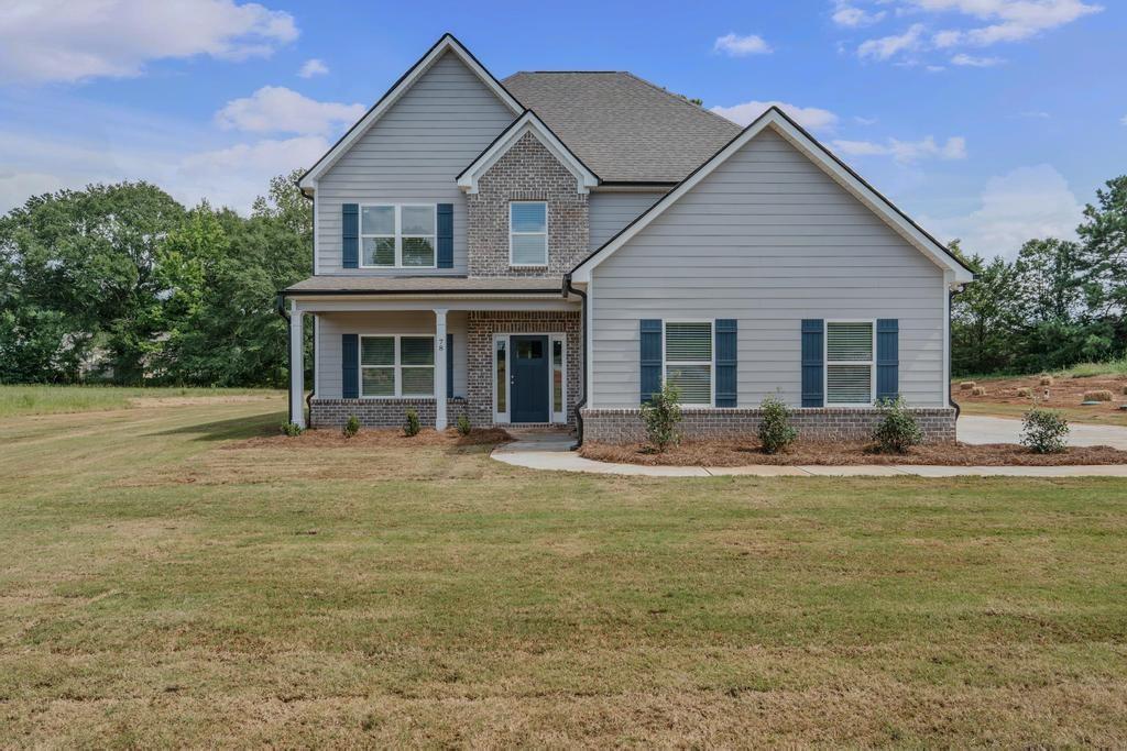 This large home features a guest suite on the main level, an open kitchen and family room, and a separate dining room perfect for entertaining. Upstairs, you'll find the master suite along with three additional bedrooms. Enjoy peaceful outdoor living with a covered back patio, all set on a beautiful 2+ acre lot in a highly sought-after school district.