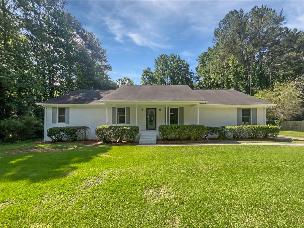 Welcome home! This charming 3-bedroom, 3-bathroom Jonesboro house is ready for your personal touches! The home has fresh exterior paint, a new deck, a brand new septic system, updated flooring in many rooms, and more! The neutral color paint scheme throughout the home provides a calming and versatile backdrop for your personal style. The kitchen offers freshly-painted cabinets, granite counters, and a stylish tile backsplash. Outdoor living is a delight with covered deck for entertaining or relaxing, and a fenced-in backyard for privacy. This property is a perfect blend of comfort and style, waiting for you to make it your own!. Included 100-Day Home Warranty with buyer activation