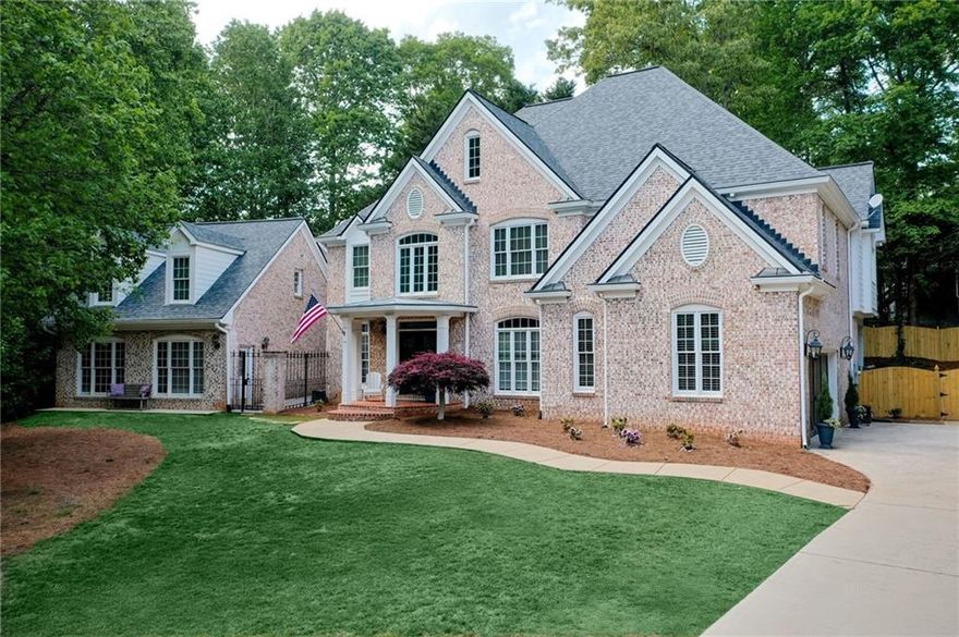 Tour this timeless three sided brick estate home complete with a beautifully appointed carriage house where refined craftsmanship meets everyday luxury.
Step into the formal foyer and be greeted by a sophisticated dining room featuring elegant dental molding and wainscoting. Just off the foyer, a versatile home office space can easily serve as a formal living room to suit your needs.
The heart of the home is the stunning family room with vaulted two story ceilings, a shiplap fireplace and seamless flow into the newly renovated kitchen.  Designed for both style and function, the kitchen boasts a large island, breakfast bar, stainless steel appliances with warming drawer, subway tile backsplash and a custom built surrounding refrigerator with abundant storage. An additional built-in sideboard with wine rack enhances the adjacent breakfast area. A butler’s area or bar connects the kitchen to the main hallway, perfect for entertaining.
The main floor also features a charming half bath with beadboard detailing, a full laundry room for added convenience and hardwoods throughout. 
Upstairs, the oversized owner’s suite offers a peaceful retreat with a tray ceiling, sitting area or second office space and a spa like bath complete with double vanities, a jetted bathtub, seamless glass shower with dual heads and a spacious walk-in closet with custom cabinetry.  A guest suite and two additional bedrooms connected by a jack and jill bath complete the second floor.
The full unfinished basement offers second laundry hookups and endless potential whether you envision a home gym, theater or simply need ample storage.
The Carriage House is such a bonus! This exceptional space includes a generous living /dining area combination, kitchenette with sink and fridge, a renovated full bath upstairs with a bedroom and an additional room perfect for an office or studio-ideal for guests, rental income or extended family. 
2 car side entry garage; Nice walk out deck overlooks the landscaped and fenced backyard.