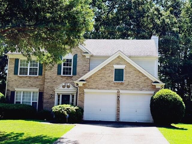 Gorgeous, Great Location in Sugar Hill with lots of room to grow, well-maintained 4BR/2.5BA home situated in the highly sought-after and excellent North Gwinnett School District. This residence offers a serene and safe neighborhood. The main level features hardwood floors throughout. The chef's kitchen boasts newer granite countertops, an island, and newer stainless steel appliances. The upper level includes four spacious bedrooms, two full bathrooms, and a laundry room. Enjoy modern comfort with updated bathrooms, a newer roof and carpet, a newer water heater, and newer interior painting. The property also features a private, wooded backyard with a patio. This is a tremendous opportunity at a great price in a wonderful swim/tennis community. MUST SEE!