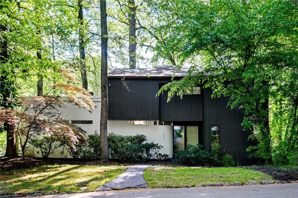 When opportunity knocks, open the door! This rare and stunning renovated mid-century modern home is full of light, good energy and positive flow. Thoughtfully restored to show its original character with subtle Bauhaus style architecture. This spacious five-bedroom home is deceiving from first glance. The layout allows for so much useful space for a growing family but also cozy enough for a chic single. Two car tandem garage is perfect for an automotive aficionado with ample storage and plenty of daylight. Master on the main features a private deck for enjoying morning coffee and a custom rainfall shower will make you never want to leave home. Kitchen has all new custom cabinetry and smudge proof new appliances with a gas cooktop and vent hood. Lots of windows everywhere and designer cutting edge lighting make this home so bright and joyful. The neighborhood is one of Atlanta's best kept secrets with the Mountain Way Common Park directly across the street. Nature abounds in this quiet, serene setting that is only minutes from the best Buckhead has to offer. Walk to Path 400. Unique and exceptional home that is ready to move in as a furnished or unfurnished rental.