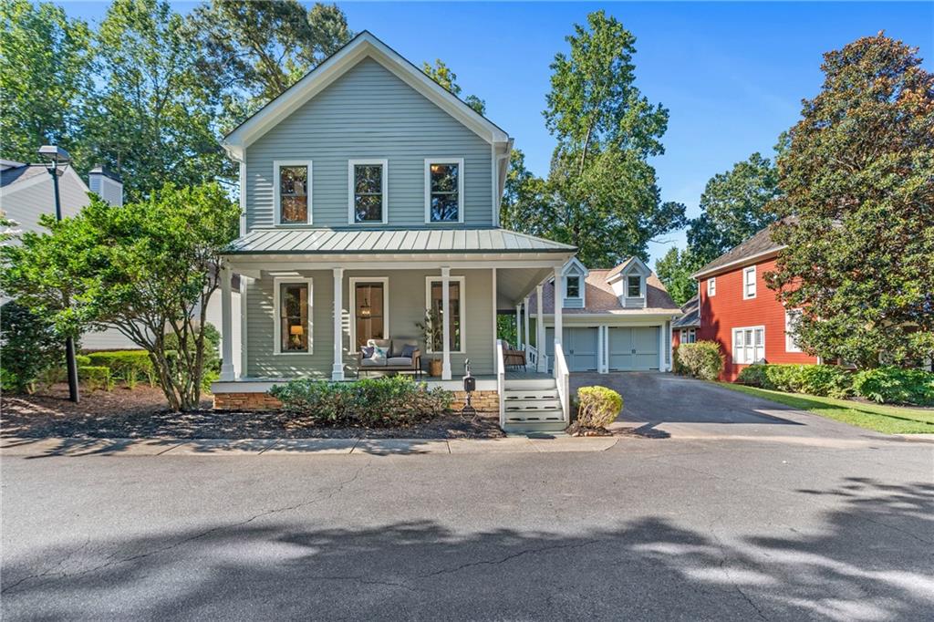 Quaint cottage style home in the sought-after Towne Lake Hills North golf course community tucked away in the private street section of THE ENCLAVE. These homes don't come available very often! This beautifully remodeled 3-bedroom, 3.5-bathroom home offers timeless character blended with fresh updates throughout. From the moment you arrive, the wrap-around porch and charming curb appeal set the tone for this special property. Step inside this warm and inviting retreat where nature takes center stage. Rich knotty pine walls and accents along with ceilings details that bring a rustic authenticity, while hand-selected cherry wood and timeless hardwood floors create a foundation of elegance. Overhead, reclaimed genuine antiqued timbers from Pennsylvania—repurposed into stunning mantels and ceiling beams—add history, craftsmanship, and character to every room. The blend of wood tones, textures, and natural finishes gives the home a soulful, organic feel—like living in harmony with the forest, wrapped in warmth and timeless beauty.
refinished hardwood floors, and fresh interior and exterior paint. The main level features a warm and inviting living room with a fireplace, a spacious dining area, and an eat-in kitchen that overlooks the wooded backyard and golf course. Step outside to the back deck, where you’ll enjoy peaceful views and plenty of space to relax or entertain. Upstairs, you’ll find the oversized primary suite, a secondary bedroom, and a versatile office/bonus room—perfect for remote work, hobbies, or a playroom. The finished basement expands your living space even further, offering a private bedroom with custom built in bed and gorgeous built ins, two closets and full bathroom, along with a walkout patio ideal for guests or entertaining. The basement also has a mirror filled workout room, large cedar closet and built in sauna. Additional highlights include a detached two-car garage and large backyard backing up to the golf course. Large back deck overlooks woods and golf course. Thoughtfully updated finishes that make this home move-in ready. ALL NEW EXTERIOR AND INTERIOR PAINT. WATER HEATER NEW 2021. All of this in a prime location with access to golf, swim, tennis, pickleball, swim team, playgrounds, restaurant, and top-rated schools—just minutes to shopping, dining, parks, and Lake Allatoona just minutes down the road. Just 4 min drive to Downtown Woodstock.