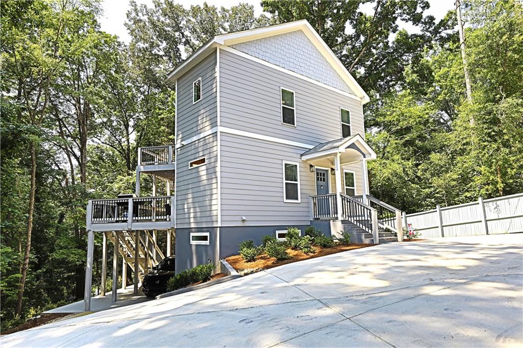 CURRENTLY A 5-STAR AIRBNB. THIS "LAKE RETREAT NEXT TO ATLANTA" IS ONE OF THE "MOST BELOVED HOMES" PER AIRBNB. Brand new construction in 2024. Excellent feedback from showings and guests. Great setting with 178' of waterfront on a small quiet lake in sought after Cobb County! Only 18 miles to downtown Atlanta and 11 miles to the Braves Battery arena. Walking distance to South Cobb H/S and close to the excellent amenities nearby: golf, tennis, shopping, hospital, etc. Stunning quality inside and out. Two large decks on main and upper levels! Gorgeous concrete driveway around the house can park 6+ vehicles! Privacy fencing, professional landscaping, nice walkways by the lake and a platform on the water. Beautiful interior is light and bright throughout, including the daylight walk-out basement with 10' ceiling. Light gray hardwood flooring and huge custom kitchen. Master bedroom upstairs has tray ceiling and double vanity. Basement is a full aparment with kitchen, bath and laundry! Lake view from windows--watch ducks and geese. Brawner Lake is a hidden treasure, with fishing and waterfowl galore. This property is a gem! Construction was inspected and approved by the country -- see Certificate of Occupancy in photos. A rare opportunity for either owner occupant or investor. Note: Owner financing available with at least 25% down, and APR lower than the bank. Showings only by appointment in between Airbnb bookings.