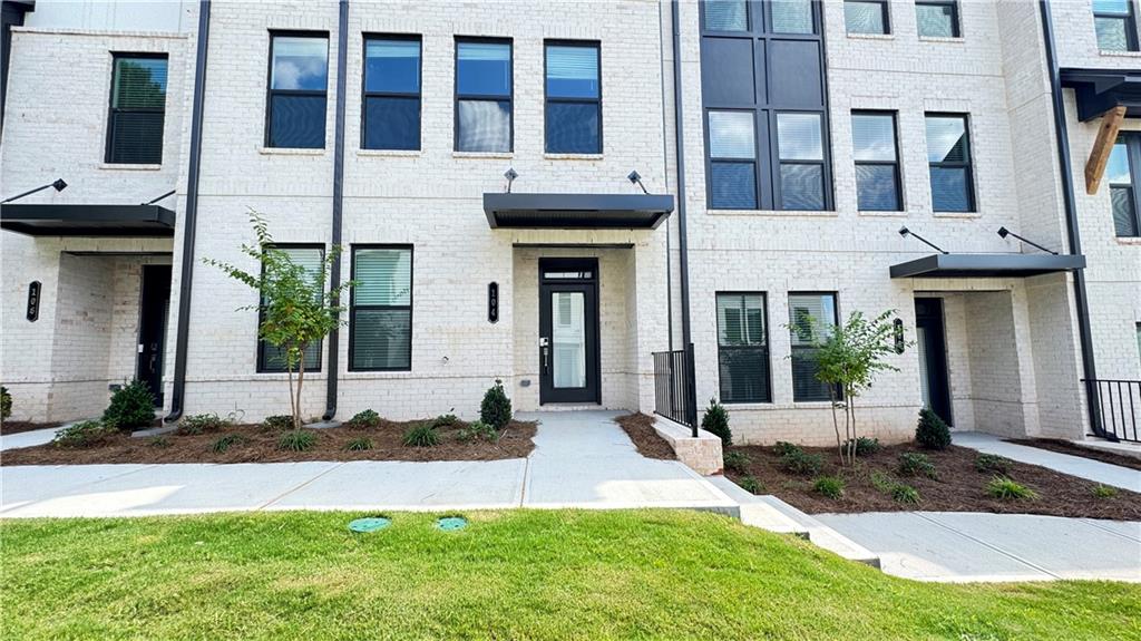 Only $2750 for this stunning 4 Bedroom/ 3.5 Bathroom New Construction Townhome within 1 mile of Downtown Lawrenceville and The Lawn Amphitheatre. Relax and unwind on your covered deck or enjoy a picnic on your front lawn. This townhome faces a beautiful green grassy courtyard. On the lower level is a spacious bedroom and a private bathroom. Upstairs, you have a stunning kitchen with white cabinets. This huge kitchen island comfortably accommodates 4 barstools and opens up to the outside deck, partially covered and has a ceiling fan, allowing you to relax and enjoy the outdoors. You also have a large walk-in pantry and powder bath conveniently located off the kitchen area. To complete this level, you have an expansive dining room that can easily accommodate a table for 8 and opens up to the family room, overlooking the park with a wonderful wooded view. Upstairs, you have the master bedroom, which also overlooks the park and the master ensuite with a double vanity and tile surround master shower.
At the end of the hall is the laundry room, along with two additional guest bedrooms and a shared bathroom. Make this gorgeous townhome yours, and enjoy the convenience of Downtown Lawrenceville, which offers a multitude of restaurants, shops, free concert series, family events, and parties in Downtown Lawrenceville at The Lawn ~ (See photos in the listing), and enjoy the great outdoors with Rhodes Jordan Park offering 162 acres of nature and 1.9 miles of walking trails. Rental Criteria: Verifiable Income of 3 times the rent, Excellent Rental History, and no late credit on credit report in the last 2 years. Pets are accepted on a case-by-case basis. Driving Directions: GPS to 100 E. Crogan Street, Lawrenceville. You enter the park entrance, and the community will be on your right.