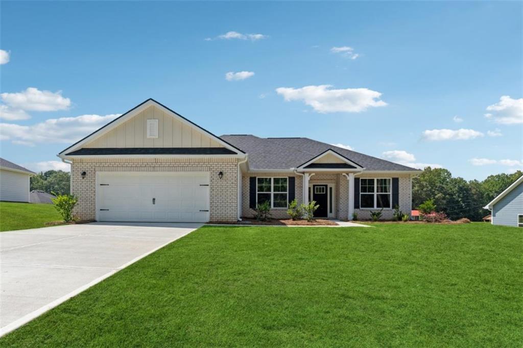Welcome to this "Park Place Sanctuary" - A Bright and Vibrant - 3 Bedroom / 2 Bed - Ranch Retreat in the Park Place community! Envision waking up in your 1826 sq. ft. dream home in Park Place, affectionately known as "The Friendly City", Bowdon, GA. A bright and breezy floor plan perfect for laid-back living, tucked into the heart of a community that feels like home from day one. Natural light fills the walk-in foyer and dining room, leading into the great open-concept family room, with the elegance of a electric fireplace to just unwind from a long day or a romantic evening. The kitchen hosts a gorgeous granite countertop island awaiting your gourmet meal prep and a pantry just waiting to be filled. This beautiful split-bedroom layout offers 2 spacious secondary bedrooms and a full bath as you walk into the hallway. The amazing owner's suite has a luxurious soaking tub, a separate shower, and a walk-in closet. This thoughtfully designed space offers both privacy and connection, creating the perfect atmosphere for modern living. Picture yourself unwinding on your covered lanai, overlooking a peaceful and spacious backyard for outdoor living and family barbeques. Whether hosting lively gatherings or enjoying a quiet evening, this home is designed to enhance every moment of your life. Built for quality and efficiency, "The Park Place Sanctuary" features architectural shingles for durability and two water heaters to ensure lasting comfort and peace of mind. you'll enjoy natural light throughout the day, making every room feels warm and inviting. Situated in Carroll County, minutes from I-20, local Bowdon schools, Tanner hospitals, and the University of West Georgia and West Georgia Technical College along Georgia State Routes 100 and 166, Bowdon combines small-town charm with convenient access to nearby communities, local downtown restaurants, and boutique shops. Near Carrollton Greenbelt walking trails, Little Tallapoosa, Hays Mills, and John Tanner Parks, great for outdoor life, hiking, biking, walking, boating, and fishing. USDA financing eligibility, and only $1,000 in earnest money required, making homeownership affordable and attainable. This is your opportunity to own a residence that perfectly blends style, efficiency, and affordability. Schedule your private tour today and start making memories in "Park Place Sanctuary."