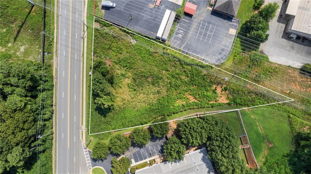 Location, Location, Location! Commercial land close to I-75 Bells Ferry Rd and Cobb parkway. 13,500+ AADT traffic count Marietta city limits, already Zoned CRC. Build your custom business building on this one acre lot. The City of Marietta Zoning is attached to the listing documents to show you the vast amount of different business allowed. The survey is attached as well.