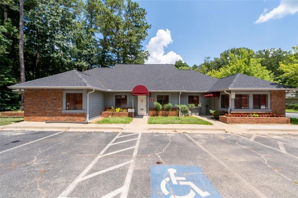 Incredible opportunity to own a fully leased commercial office building in one of Atlanta’s fastest-growing areas. Located at 2950 Stone Hogan Connector Rd SW, Building 4, this 3,000 SF property features 14 private rooms, 3.5 bathrooms, and a brand-new HVAC system. The building is currently leased to a stable tenant through December 2026, offering immediate cash flow and long-term investment potential.
Perfectly positioned across the street from a massive new multi-family development that is currently under construction and surrounded by established single-family neighborhoods, this property sits in a prime spot for continued appreciation. Its flexible layout makes it ideal for future use as a medical office, professional office, or even a childcare or nursery school.
Just a minute from the former Tyler Perry Studios at Greenbrier, this area is undergoing tremendous transformation. With easy access to I-285 and major commercial hubs like Camp Creek Marketplace, this is a can’t-miss opportunity for investors or end-users alike.
This property is priced to sell fast. Act now to secure a high-quality, income-producing asset in the path of growth.