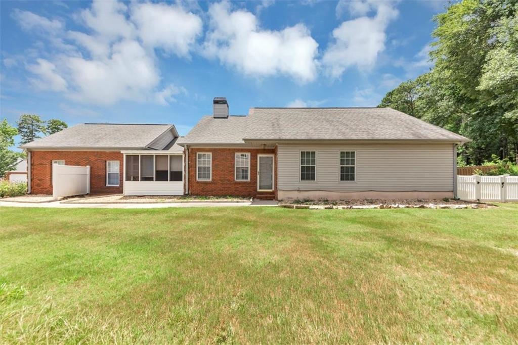 Don't miss this adorable home nestled in the heart of Fayetteville in the prominent Woodgate Subdivision! This beautifully maintained 3-bedroom, 2-bathroom home offers comfortable living in a vibrant community with sidewalks, a pool, tennis courts, and a friendly neighborhood atmosphere, this home is perfect for those seeking both comfort and convenience. This move-in-ready handicap accessible home features a spacious layout, ideal for both relaxing and entertaining. Enjoy a bright and airy living area, a spacious dining room, a eat in kitchen with a breakfast area, a quaint and peaceful sunroom and generously sized bedrooms, including a primary suite with a newly renovated private bath featuring dual vanities and a large walk-in shower. Whether you're a growing family, first-time homebuyer, or looking to downsize without sacrificing comfort, this home offers the perfect blend of space, convenience, and tranquility. Home is located to nearby shopping centers, popular eateries and 30 minutes from Hartsfield Airport. More photos to come!