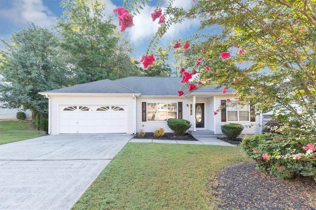 Step into a home that radiates charm and functionality from the moment you arrive. The great curb appeal sets the tone, as the home welcomes you into a bright and inviting space with soaring ceilings upon entry. Upgraded luxury vinyl flooring throughout, a cozy brick fireplace as a focal point in the living area, and a stylish kitchen featuring stainless steel appliances, white cabinets and sleek quartz countertops. Overlook the backyard from the spacious wood deck, which is fenced and offers privacy and space—ideal for entertaining, pets, or play. Schedule a tour today!