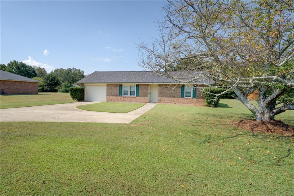 Adorable 2BR/1BA Four-Sided Brick Ranch with New Roof! Welcome home to this charming two-bedroom, one-bath brick ranch, nestled on nearly half an acre of flat, usable land-perfect for a garden, play space, or fenced-in yard for your furry companions! Inside, you'll love the open-concept living and kitchen area, ideal for entertaining. Pull up a bar stool at the counter and chat with the cook, or relax in the living space while staying connected to the heart of the home. The spacious primary bedroom connects directly to the oversized bathroom, which features a large linen closet and beautifully preserved original tile flooring. The second bedroom offers convenient hall access to the same bathroom-great for guests or roommates. Step out onto the back patio and enjoy your private outdoor space. The attached one-car garage includes a generous storage room, giving you even more room to stay organized. Additional highlights include:New roof (recently installed), New luxury vinyl plank (LVP) flooring throughout (2022) ,New dishwasher (2024) Located just minutes from downtown Conyers, GA, you'll enjoy easy access to local dining, shopping, theater, and more. Plus, I-20 is just around the corner-making commuting a breeze and getting to the airport quick and convenient. Don't miss this cute, move-in-ready gem-it's the perfect blend of cozy charm and modern updates!