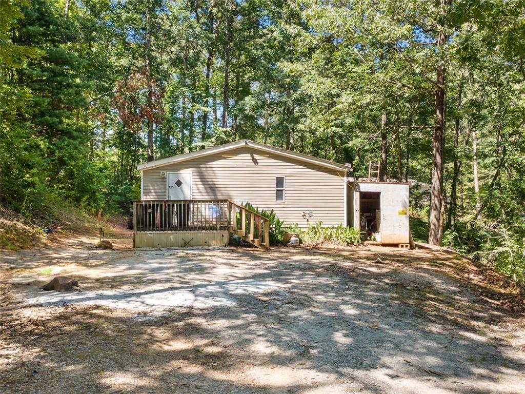 Nestled on a spacious 1.29-acre lot, this 3-bedroom, 2-bath home offers the perfect blend of privacy, potential, and proximity to town. Located just a short 20-minute drive from downtown Dawsonville, this property is ideal for those seeking a peaceful retreat with room to grow.
Inside, you'll find a functional layout with great bones, ready for your personal touch. Whether you're a first-time buyer looking to build equity or an investor searching for your next project, this home is full of opportunity. The generous lot provides ample space for gardening, outdoor entertaining, or even future expansion.
While the home does need a little love, it’s a rare find at this price point with acreage in such a desirable location. Bring your vision and make this house your own!