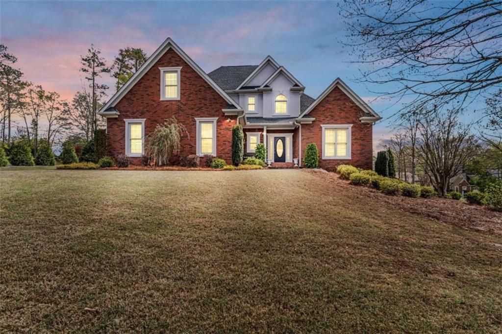 Welcome to your dream home in the gorgeous Lakehaven subdivision of Henry County! This well maintained brick two-story residence offers an abundance of space and luxury features, perfectly complemented by the amenities of the Lakehaven Community, including access to two swimming pools and tennis courts. As you step inside, you're greeted by the inviting family room, adorned with high vaulted ceilings, a cozy fireplace, and classic archways leading to the formal dining room, setting the stage for elegant entertaining and comfortable family gatherings. The spacious kitchen is a chef's delight, boasting two pantries, silestone counters, a convection oven, and a convenient laundry hookup. The main level is crowned by the expansive primary suite, featuring trayed ceilings, a generous walk-in closet, and an en suite bathroom complete with double vanities, a soaking tub, and a separate tiled shower, offering a private sanctuary for relaxation. Upstairs, three additional bedrooms await, each generously sized and conveniently serviced by a full bath nearby. The full finished basement is a haven for entertainment and versatility, offering both interior and exterior access points. Here, you'll find a game room with a pool table included, a second living room with a ventless fireplace, several storage rooms, and a full bathroom with laundry hookups. With its flexible layout, the basement could easily serve as an in-law suite or guest quarters. Situated on a spacious 0.54-acre corner lot, the property features a raised back deck and an irrigation system, perfect for outdoor enjoyment. The fully landscaped yard is adorned with an outdoor light system, enhancing the curb appeal and creating a welcoming ambiance. Don't miss the opportunity to make this exceptional residence your own and experience the epitome of luxurious living in Lakehaven!