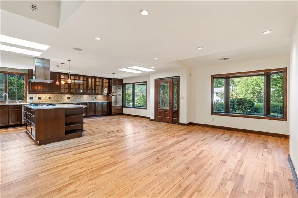 Two Homes + Private Pool + Park-like Backyard nestled on a .72-acre lot just minutes from vibrant Downtown Roswell, West Roswell Park, shopping and dining and top schools.
The 3BR/2.5BA main home boasts an open-concept living space with a renovated kitchen at the heart of the home. An elegant sunroom with a wall of windows offers serene garden views. A half bath completes the main level. Upstairs, the primary suite features a thoughtfully designed owner’s bath with a steam shower, double vanity, whirlpool tub, bidet and private balcony. Two additional bedrooms share a full bath. The lower level includes a mudroom with washer and dryer, plus a flexible space that can serve as an office or storage.
The single-level 2BR/2BA guest house welcomes you with a charming front porch and offers a fully equipped kitchen, great room, a primary suite with full bath, walk-in closet, and laundry hookups, as well as an additional ensuite bedroom.
Step outside to your own private, park-like retreat. The backyard showcases a sparkling swimming pool, perfect for summer relaxation and entertaining. Paved walkways create a graceful flow between lounging areas, vintage-style lighting, Japanese maples, azaleas, camellias, and shaded spots beneath mature trees. Surrounded by greenery and thoughtfully designed hardscapes, this outdoor oasis offers both beauty and functionality—a true extension of the home where you can unwind, host, or simply enjoy the peaceful setting.
Both homes were fully renovated in 2008, including plumbing, electrical, and septic systems. Recent improvements in the main house include fresh interior paint, refinished hardwood floors in the main living area, new fridge, new cook top, new microwave oven combo, new balcony off primary suite. Offering space, versatility, and a backyard oasis, this home is where memories are meant to be made.