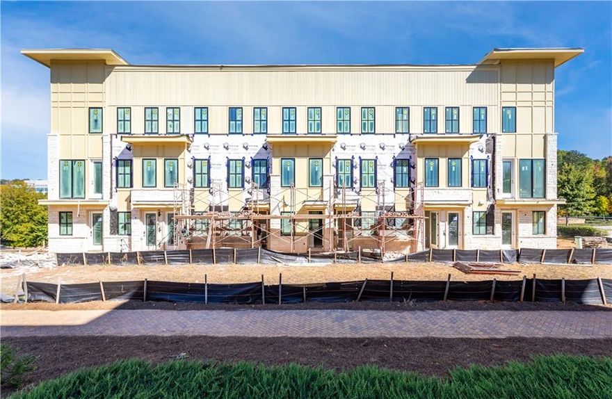 Welcome to your new condo flat in Monte Hewett's newest neighborhood in Alpharetta, Findley Row! This is a rare opportunity to find your new end unit condominium built by the same builder that designed the homes in Avalon, Halcyon and many other well-known neighborhoods throughout Atlanta.  As you walk in the front door you will see the luxurious White Oak Hardwood floors that carry throughout the home, Quartz countertops in the Kitchen and bathrooms, Bell custom cabinetry, tile to the ceilings in the bathrooms and so many more high-end finishes. Currently the first 3 buyers will enjoy $10,000 Seller paid closing costs when you sign your new home agreement in January 2025. The Kitchen features a large island with plenty of room for entertainment and a walk-in pantry for great storage. The main floor entrance on the front of the building has all of your great living space on one level including your covered patio and bedrooms. The professionally designed bathrooms are the perfect color combinations. You will head downstairs for the oversize two-car tandem garage that offers private parking with tall ceilings that are perfect for storage. Findley Row is located in Northwinds Summit that will feature a boutique hotel, retail, dining and office space, as well as very convenient access to GA-400. Enjoy the Alpharetta location without the local traffic. Contact us to schedule a private showing and experience the exceptional lifestyle you will enjoy in Findley Row!