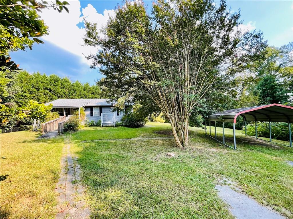 Welcome to this cozy ranch home nestled in Paulding County. This 2 bedroom/1 bath home offers timeless charm, while maximizing every square foot. The outside of the property features a level front and back yard with mature landscaping that's perfect for gardening, relaxing or entertaining. This home is the epitome of peaceful mornings on the front porch. Located just minutes north of Villa Rica and south of Dallas, Ga. Don't miss this opportunity and schedule a showing today.
