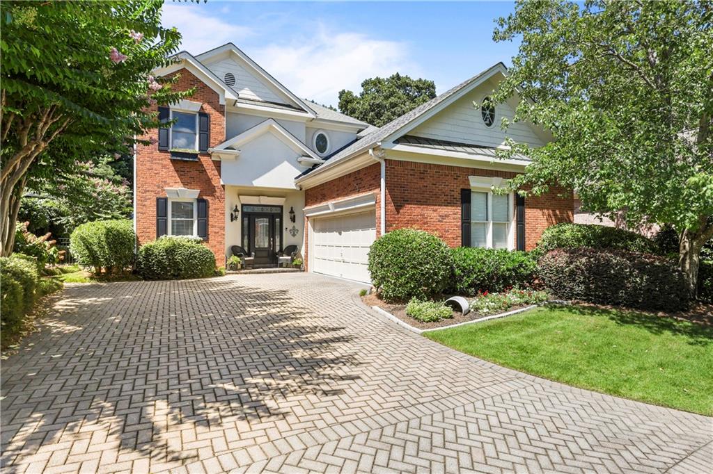 Nestled within the exclusive gates of Brookhaven's coveted Arbor Trace, this luxurious 4-bedroom, 2.5-bathroom single-family residence is a haven of sophistication and comfort. The cobblestone streets lead you to a home that boasts soaring ceilings and a flood of natural light, accentuating a wide-open floor plan tailored for the most discerning of buyers.
A hard to find Master on Main retreat offers a serene escape, complete with a cozy fireplace, a spacious sitting area, and an intricate multi-trayed ceiling. The recently renovated spa-like Master bath beckons with its modern tub, frameless glass shower, and chic finishes. Throughout the home, rich walnut hardwood floors pave the way to a chef's kitchen featuring custom cabinets, a generous island, and top-of-the-line stainless appliances.
Entertaining is a delight in the spacious Family Room, adorned with a fireplace and custom built-ins. The separate dining and living room with a wall of windows and two-story ceiling provides an elegant space for all gatherings and holiday parties. Ascend to an upstairs with 3 additional spacious bedrooms, Loft, and bonus area, equipped with built-in shelving, ideal for a sophisticated home office.
Architectural design touches, including elaborate molding and arched doorways, add to the home's unique and wonderful charm. Outside, an extended covered patio opens to a private, fully fenced backyard oasis, showcasing beautiful green spaces, professional landscaping, flowers, and stone details—a true luxury living experience.
The location can't be beat. Minutes from the area's best dining, shopping, and entertainment, including, Dresden Shops, Town Brookhaven, Buckhead, MARTA, and easy access to I-85 and GA 400. Under 1 mile to Phipps Plaza and Lenox Mall, plus Lenox Park is just across the street, offering paved walking trails, duck pond, and dog park. Very close to access the new CHOA Hospital, Emory, and CDC, and all the amenities Buckhead and Brookhaven have to offer.