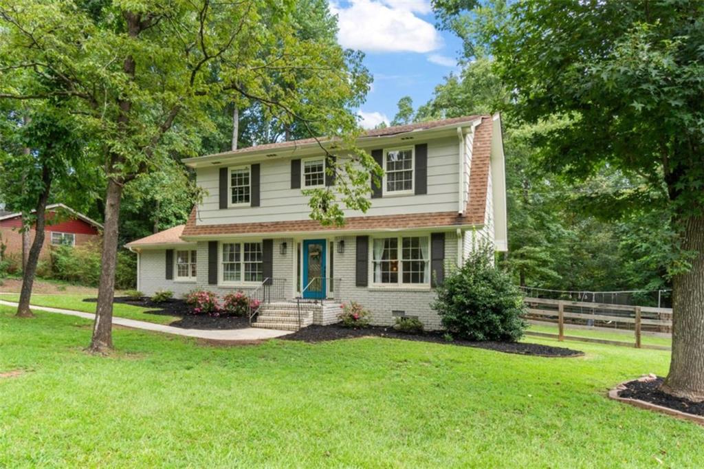 This delightful 4-bedroom, 2.5-bath residence perfectly situated in the vibrant heart of Sugar Hill. From the moment you step inside, you'll be greeted by a warm, inviting atmosphere that instantly feels like home. The main level features beautiful hardwood floors, adding timeless style and easy maintenance throughout the living spaces. The updated kitchen showcases granite countertops, new appliances, ample cabinetry, and generous counter space-ideal for both everyday living and hosting gatherings. The spacious living area offers a cozy fireplace, creating the perfect setting for relaxing evenings. Step outside to discover a large, fenced backyard complete with an expansive deck-perfect for outdoor dining, entertaining, or simply enjoying your morning coffee in privacy. Located within walking distance of the exciting downtown Sugar Hill area, you'll have easy access to local restaurants, shops, entertainment, and community events. With no HOA, you'll enjoy flexibility and freedom while still being close to everything this desirable area offers. Don't miss this opportunity to own a freshly renovated and move-in ready home in one of Sugar Hill's most convenient locations!