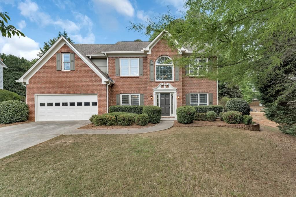 Brick-Front Traditional in Sought-After Windrose! Perfectly positioned just minutes from Halcyon, premier Shopping and Dining, and Top Forsyth Schools, this beautiful home offers the best of both worlds a Coveted Alpharetta Address with Low Forsyth County Taxes. Step inside the Two-Story Foyer Entrance to find a Formal Living Room with French Doors to the right -- ideal for a Home Office, Playroom, or Bedroom -- and a Formal Dining Room with a Tray Ceiling and Wainscoting to the left. The Bright, White Kitchen features Granite Countertops, a Tile Backsplash, and a Sunny Breakfast Room overlooking the backyard. The Fireside Family Room offers the perfect gathering space for relaxing or entertaining. A Powder Room and Laundry Room complete the main level. Upstairs, retreat to the Oversized Owner's Suite with a Tray Ceiling, Walk-In Closet, and a Spacious Ensuite Bathroom boasting Dual Vanities, a Soaking Tub, and a Separate Shower. Three additional Secondary Bedrooms and a Large Bonus Room share a Full Hall Bathroom, providing plenty of room for family or guests. Outside, enjoy an Expansive Patio overlooking a Fully Fenced, Grassy Backyard ideal for outdoor dining, play, or pets. With its prime location and timeless appeal, this Windrose home offers the perfect balance of Comfort, Convenience, and Community Living.