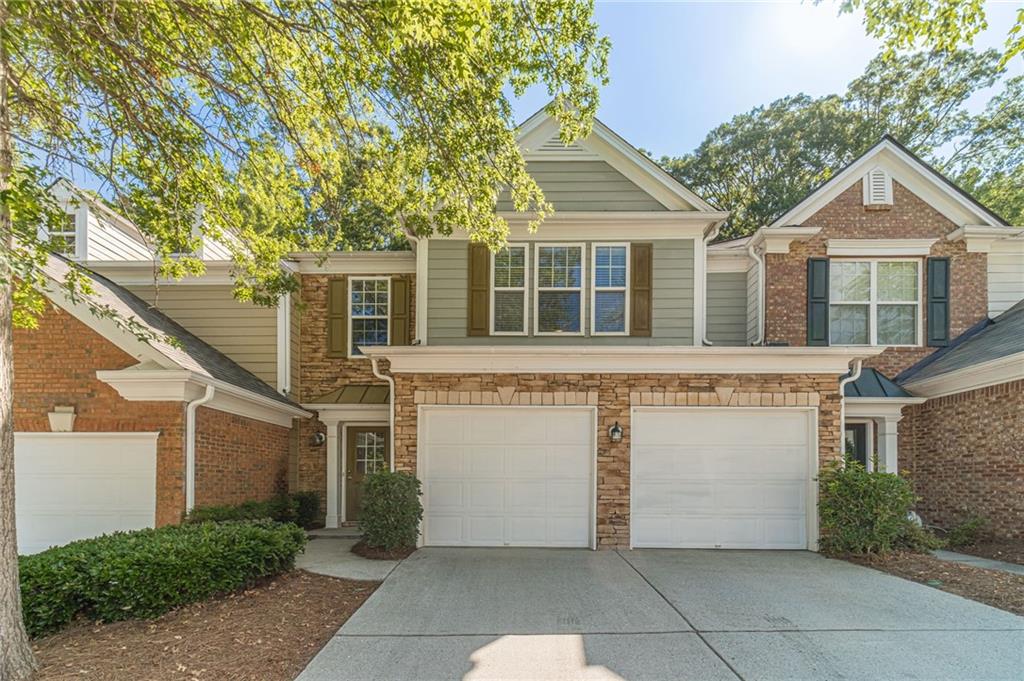 ***MOVE IN READY***LOCATION! LOCATION!! LOCATION!!! NEWLY REFRESHED & UPDATED spacious & open floor plan 2 CAR GARAGE townhome w/ PRIVATE BACKYARD in highly sought after Sugarloaf location. So many features to mention. ***NEW ROOF*** NEW HVAC*** HARDWOOD FLOORS thru-out on MAIN LEVEL. NEW FLOOR on STAIRS & NEW LUXUARY RIGID SOLID FLOORS thru-out on UPSTAIRS. **NO CARPETS** NEW STAINLESS STEEL SIDE BY SIDE REFRIGERATOR, NEW STAINLESS STEEL 5 BURNER GAS STOVE, & NEW MICROWAVE. NEW LIGHT FIXTURES in ALL BATHROOMS & NEW CEILING FANS in family room & 2 bedrooms upstairs. NEW WASHER & DRYER. NEW PAINTED GARAGE FLOOR w/ EPOXY. Had Professional pressure washing thru-out the EXTERIOR. Refrigerator, washer, & dryer will stay. Lawn maintenance is included. Community has POOL & PLAYGROUND. Top rated school district. Close to Hwy 85, Gas South Arena, Sugarloaf Mill, Shopping, & Restaurants. NO PETS & NO SMOKING. Prefers a long term tenant who can sign min 2 years lease. A MUST SEE!