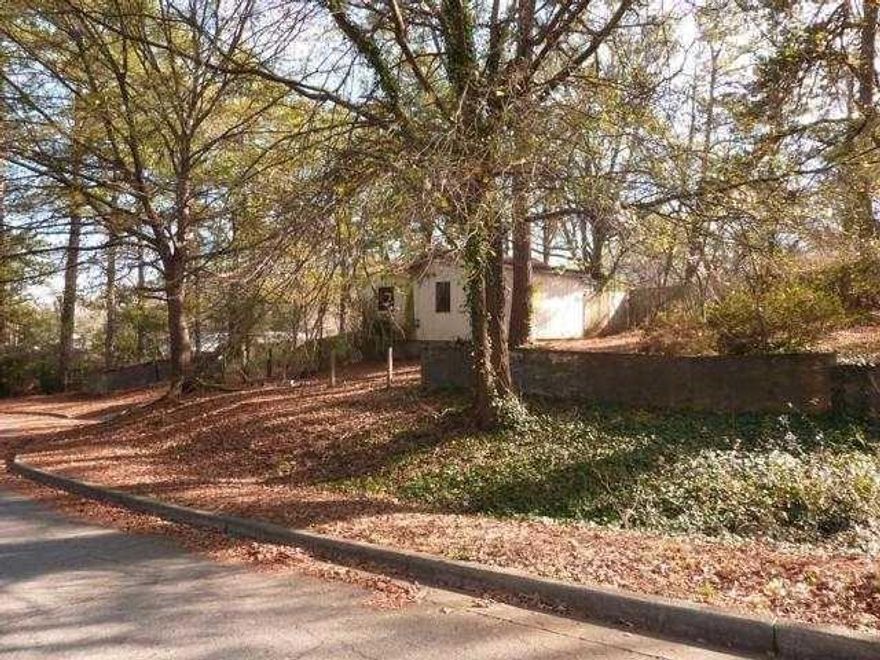 Large lot .79 acre! Lovely quiet neighborhood! Lot is on cul-de-sac with mature hardwood trees and mostly fenced. The house is not habitable, built in 1926 per tax record, and is considered a tear down. The lot does have access to full utilities. Price based on lot value. Agent related to seller and broker.